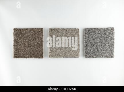 illustrazione del concetto di scelta difficile - esempi simili di tappeti grigi su sfondo bianco Foto Stock