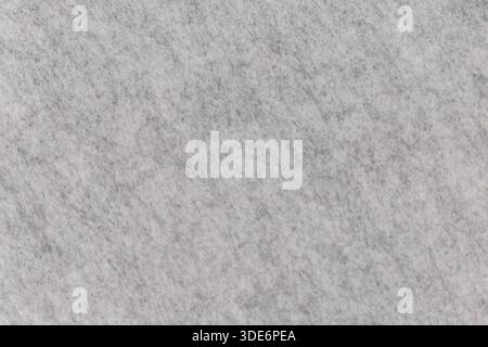 Materiale in feltro grigio che mostra un motivo uniforme e una consistenza morbida Foto Stock