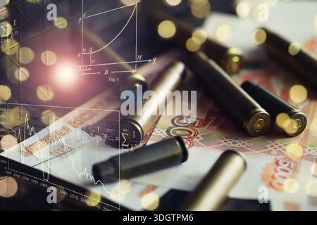 I proiettili sono in cima ai soldi Foto Stock