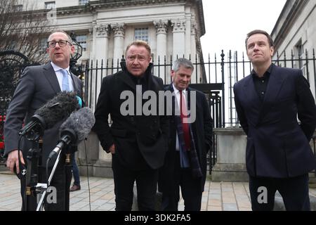 Michael Flatley (second from left) speaking to members of the media outside Belfast High Court, after a legal order blocking him from engaging with the Lord of the Dance production has been overturned. At The Chancery Court in the Royal Courts of Justice on Thursday, Mr Justice Simpson discharged a temporary injunction that had been secured against the dancer and choreographer. Picture date: Thursday January 29, 2026. Foto Stock