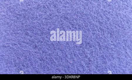 Macro Fotografia con texture in fibra sintetica viola morbida per un design creativo di sfondo Foto Stock