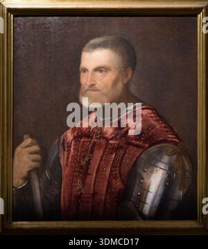 Man in Armor di Tiziano (Tiziano Vecellio), 1488-1576. Si tiene alla Pinacoteca Ambrosiana di Milano. Foto Stock