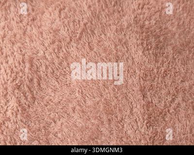 Si tratta di un primo piano di un tessuto morbido, rosa, squallido, probabilmente un tappeto, una coperta, o tessuto. Foto Stock