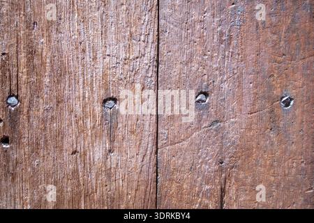 Primo piano della struttura dello sfondo della porta in legno Foto Stock