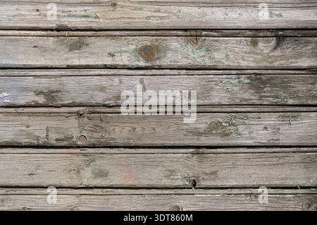 Sfondo in legno. Un vecchio muro di legno con resti di vernice. Foto Stock