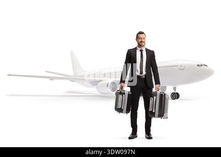 Uomo d'affari che trasporta valigie e viaggia in aereo isolato su sfondo bianco Foto Stock