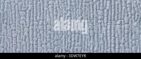 Sfondo azzurro da tessuto morbido e soffice macro. Texture dello sfondo in tessuto morbido grigio. Foto Stock