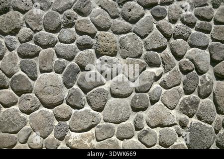 Muro di pietra sullo sfondo Foto Stock