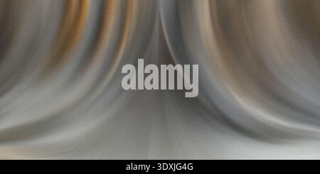 Un'immagine astratta sfocata con curve morbide e colori sfumati che creano un senso di movimento e profondità Foto Stock