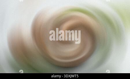 Vortice astratto di colori misti che crea un effetto visivo affascinante e dinamico in movimento Foto Stock