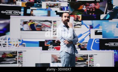 Giovane adulto di successo che si diverte sulle piattaforme di social media, celebrando i suoi successi nel conquistare follower e dominare il mondo digitale dei social network. Responsabilizzazione. Telecamera B.. Foto Stock