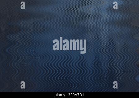 Una composizione astratta dominata da toni blu profondi con una trama fine e granulosa sovrapposta a un motivo ondulato che suggerisce un Foto Stock