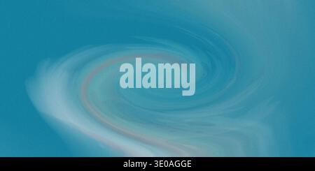 L'immagine presenta un motivo dinamico e vorticoso con sfumature di blu e rosa, che crea un effetto visivo accattivante con il suo colon sfumato Foto Stock