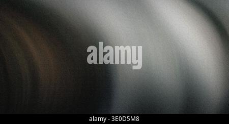 Un'immagine sfocata con sfumature di grigio scuro e marrone che creano un effetto visivo astratto e lunare. Foto Stock