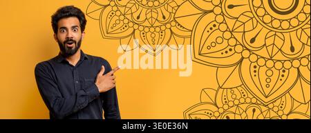 Man punta al colorato Mandala Design on Wall in una stanza luminosa Foto Stock