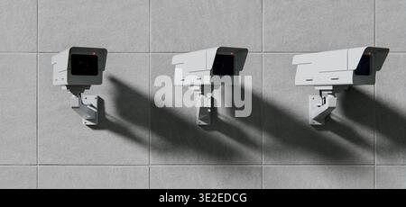 Tre telecamere di sicurezza a circuito chiuso montate a parete, sfondo di sicurezza Foto Stock