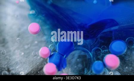 Olio bolla acqua miscela di vernice flusso glitter liquido ART Foto Stock