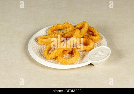 anelli di calamari fritti Foto Stock