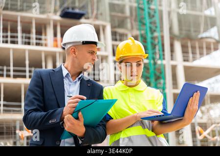 Progettare in-Chief Planning lavoro con lavoratore Foto Stock