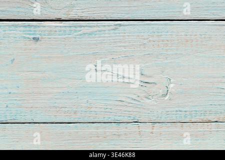 Tavole in legno vintage con vernice turchese sbucciata per uno sfondo rustico e shabby chic Foto Stock