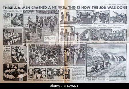 Un giornale del Daily Sketch del 1940 intitolato "This A.A. Men Crashed a Heinkel". Presenta il fotogiornalismo di equipaggi antiaerei britannici, rilevatori di suoni e operatori di ricerca durante il Blitz. Altre sezioni mostrano la Women's League of Health and Beauty, un pubblico teatrale rimasto seduto durante un raid aereo, e i bambini in un campo di fieno dell'Hertfordshire. Questa fonte primaria cattura lo spirito "Keep calm and carry on" e le operazioni militari sul fronte interno in tempo di guerra britannico. Foto Stock