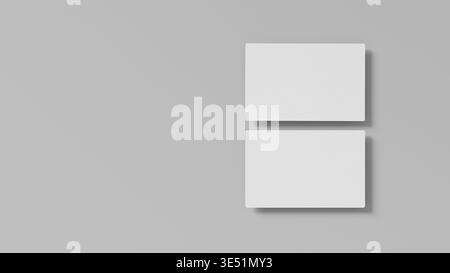 Mockup minimo per biglietti da visita su sfondo grigio chiaro con composizione pulita e forte spazio negativo ideale per il design dell'identità delle presentazioni di branding Foto Stock