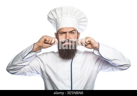 Ritratto dello chef barbuto. Chef maschile barbuti in uniforme nera e cappello bianco. Un serio chef. Chef serio Foto Stock