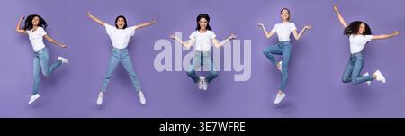 Gruppo di donne che indossano camicie bianche e jeans che saltano in posizioni diverse sullo sfondo viola in studio Foto Stock
