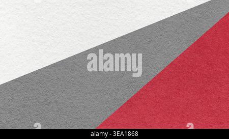 Sfondo a trama geometrica astratta con divisione diagonale bianca, grigia e rossa. I raggi modellano lo sfondo decorativo. Foto Stock