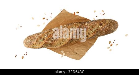 Baguette multicanale appena sfornata su carta con papavero, girasole, farina d'avena, semi di sesamo isolati su sfondo bianco. Pasticceria sana Foto Stock