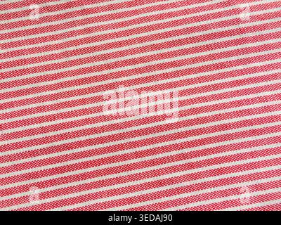 Texture macro in cotone a righe rosso e bianco Foto Stock