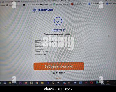 Kirov, Russia - 18 marzo 2026: Lo schermo di un computer visualizza un pagamento di utilità per le spese familiari con i dettagli di pagamento e una conferma Foto Stock