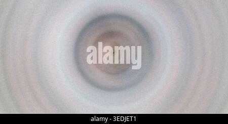 Questa immagine presenta un design circolare grigio e marrone su uno sfondo grigio testurizzato. Il motivo circolare ha un effetto sfumatura con sfumature di grigio, br Foto Stock