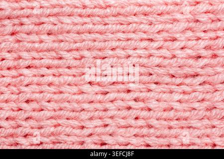 Vista dettagliata dei loop e delle fibre a incastro per creare un motivo in tessuto caldo e accogliente Foto Stock