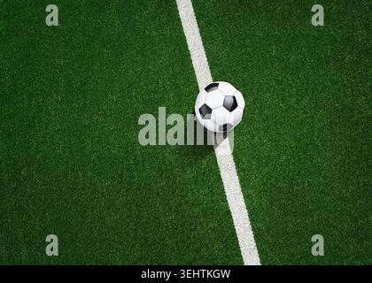 l'erba verde in linea nello stadio di calcio. Primo piano a centrocampo con punto centrale. Foto Stock