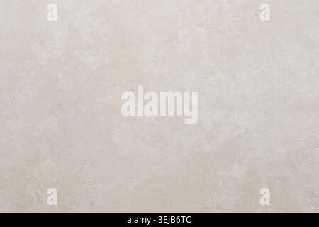 Questa superficie neutra presenta una trama morbida e uniforme. Le sue tonalità chiare e i motivi delicati lo rendono adatto a un'ampia gamma di applicazioni decorative e funzionali Foto Stock