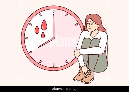 Soffre di mestruazioni dolorose sedute vicino all'orologio con gocce di sangue e ha bisogno dell'aiuto di ginecologo Foto Stock