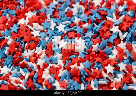 La colorata forma a stella cosparge le decorazioni per la texture del 4 luglio Foto Stock