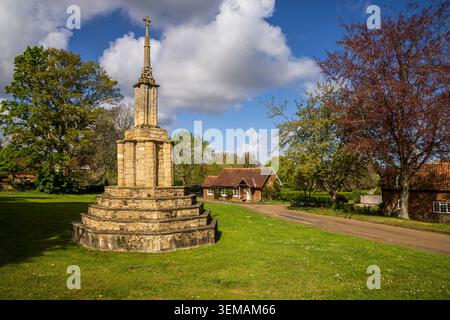 La medievale Market Cross sul "The Green" a Castle Rising, Norfolk Foto Stock