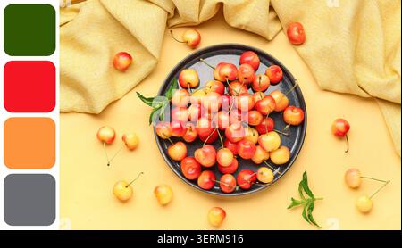Ciliegie rainier fresche su piatto scuro con foglie di menta e tessuto giallo, sano spuntino estivo alla frutta Foto Stock