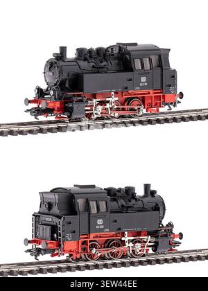 Locomotiva industriale a vapore in scala HO modello D-727 mostrata da entrambi i lati su binario ferroviario isolata su sfondo bianco. Foto Stock