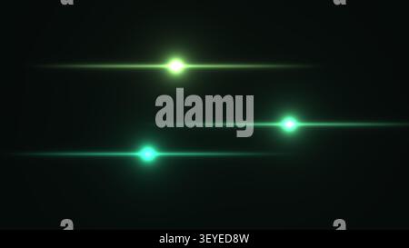 Tre luci verdi luminose appaiono come punti luminosi su uno sfondo scuro. Le luci creano un effetto visivo semplice ma sorprendente per vari usi. Foto Stock