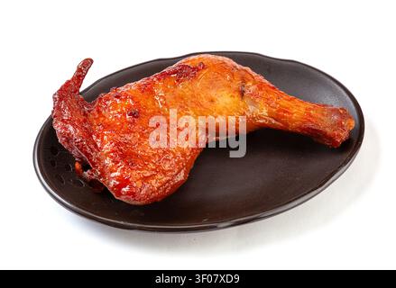 Cosce di pollo intere glassate stile Orleans, quarti di pollame arrostiti al BBQ, marinata al miele Foto Stock