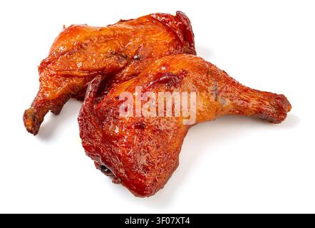 Cosce di pollo intere arrostite allo stile Orleans, quarti di pollame grigliati al BBQ, marinata dolce e piccante Foto Stock