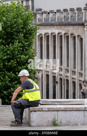 Lavoratore edile a riposo Foto Stock