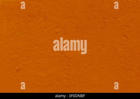 Texture di muro di cemento irregolare Arancione, sfondo in terracotta per design. Foto Stock