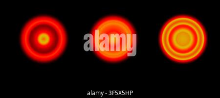 Tre sfere luminose con sfumatura rossa e arancione e grana, con anelli concentrici su sfondo scuro Foto Stock