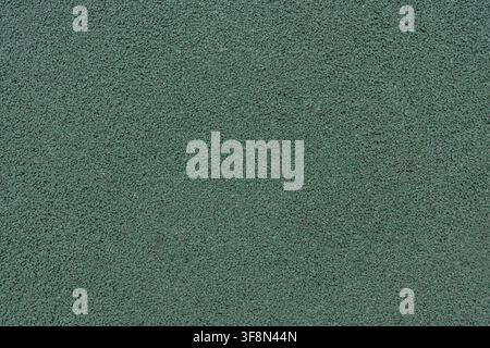 Sfondo texture in gomma verde per sport e parco giochi. Foto Stock