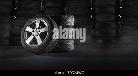 Pneumatici per auto con un grande profilo nel negozio di riparazione auto Foto Stock