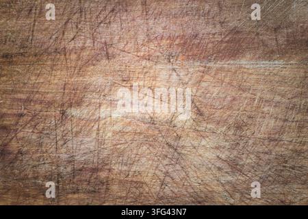Texture di legno graffiato con vignettatura. Vecchia superficie di legno malandata. Foto Stock